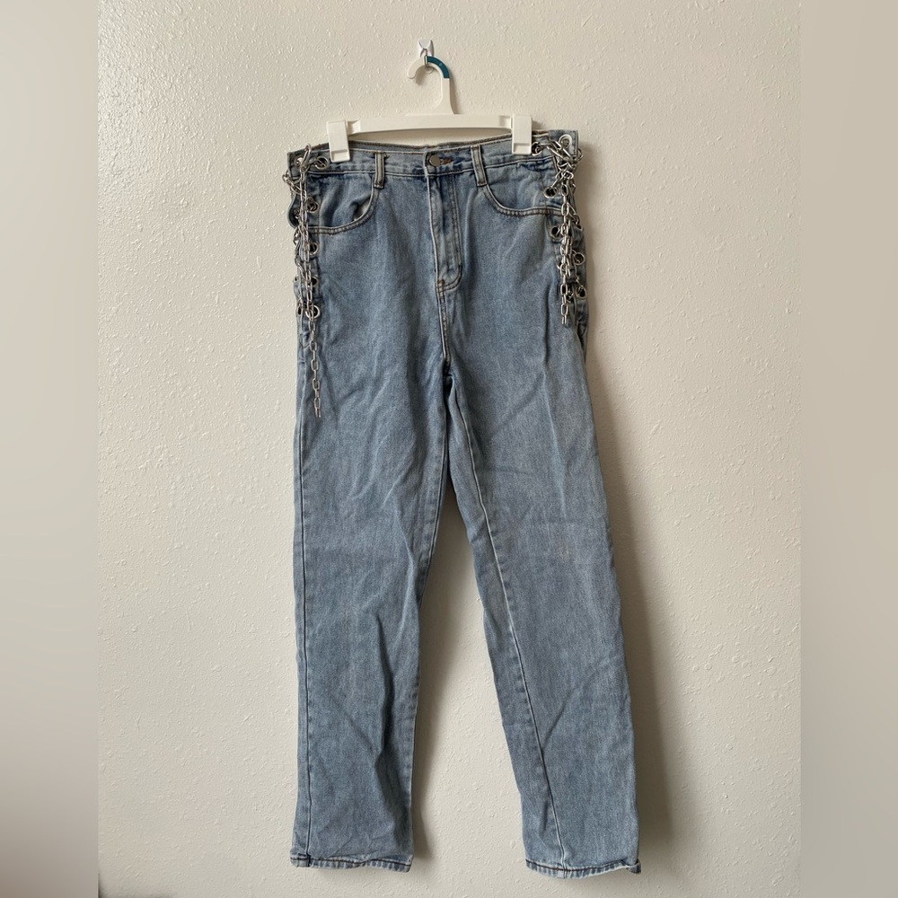 light wash jeans with lace up chains